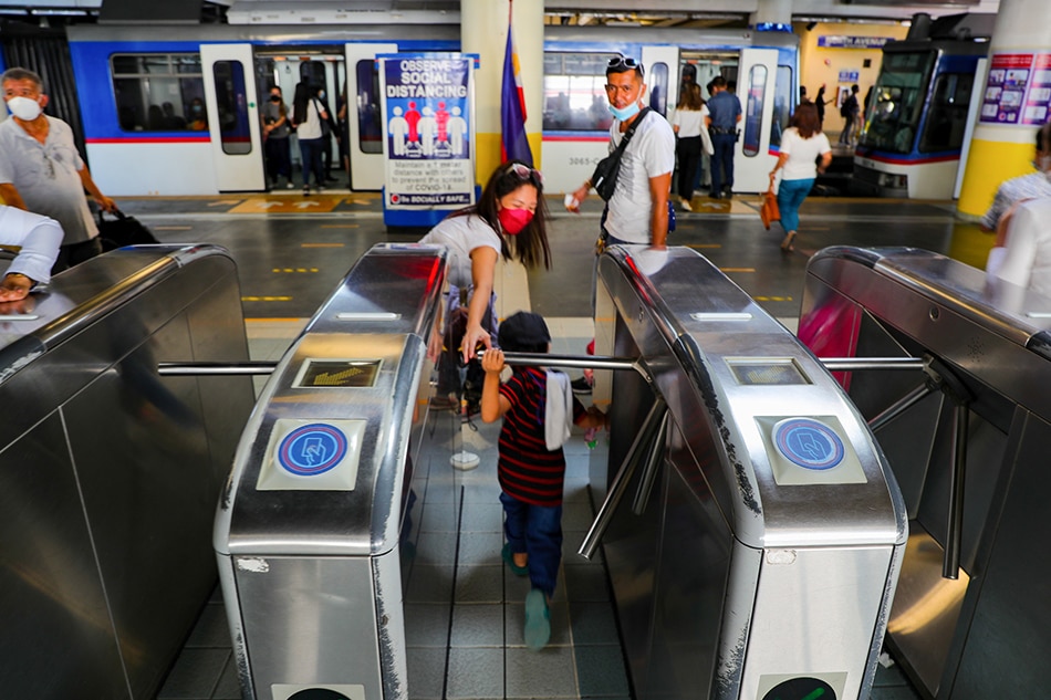 Commuters enter the Metro Rail Transit-Line 3 North Avenue Station during as they take advantage of the free train rides implemented by the government from March 28 until April 30 , 2022. Jonathan Cellona, ABS-CBN News/file