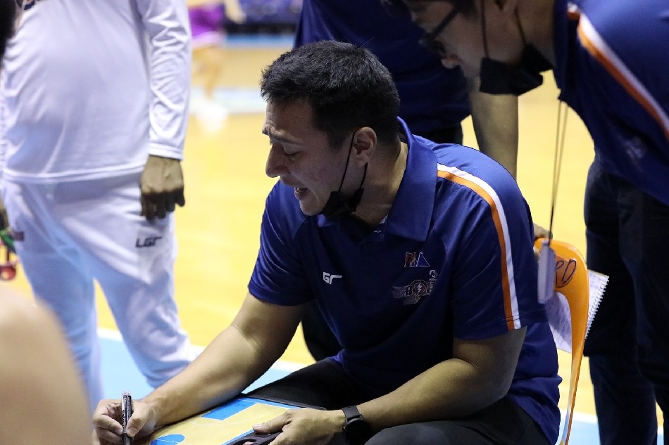 Luigi Trillo gives instructions to the Meralco Bolts during a timeout in their PBA Philippine Cup game against Rain or Shine. PBA Images