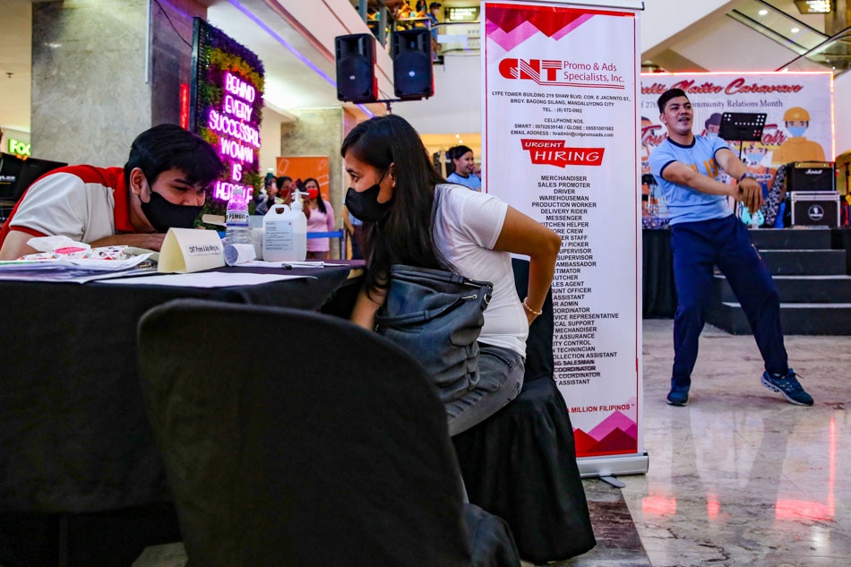 Employment-seekers watch a dance number while applying at a job fair at Farmer’s Market in Cubao, Quezon City on July 8, 2022. Jonathan Cellona, ABS-CBN News