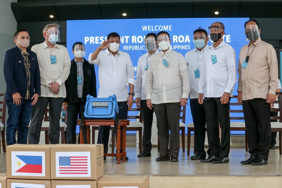 President Duterte and some of his cabinet members welcome the arrival of the Moderna COVID-19 vaccine donated by the United States government on August 3, 2021. [ITALS] Robinson Niñal, Presidential Photo