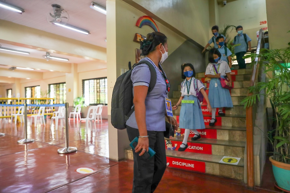 Students observe health protocols as school authorities hold a simulation for the scheduled resumption of face-to-face classes at the Comembo Elementary School Makati City on December 2, 2021. Jonathan Cellona, ABS-CBN News/file