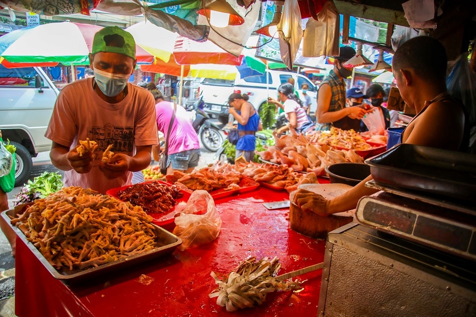 People buy fresh produce at the Bagong Silang Market in Caloocan on July 6, 2022. Jonathan Cellona, ABS-CBN News