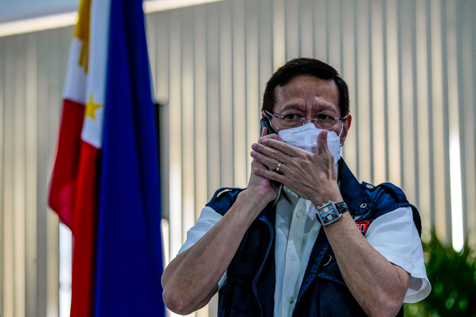 Then-Health Secretary Francisco Duque III gets busy, in one of the functions of the Inter-Agency Task Force on Emerging Infectious Disease he heads, in Antipolo City on August 12, 2020. Jonathan Cellona, ABS-CBN News