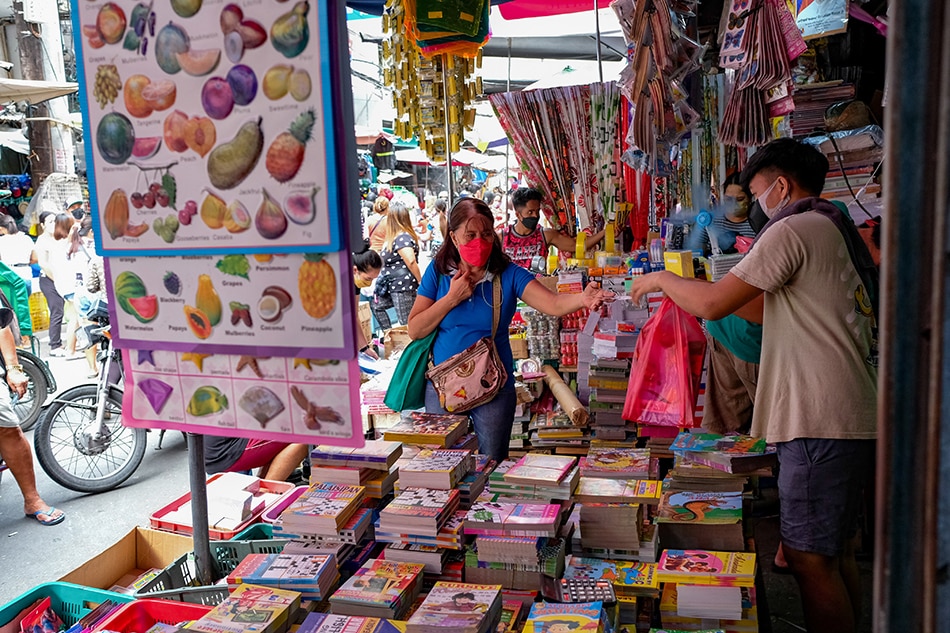 Customers buy various learning materials from a school supplies store in Divisoria, Manila on July 14, 2022. George Calvelo, ABS-CBN News