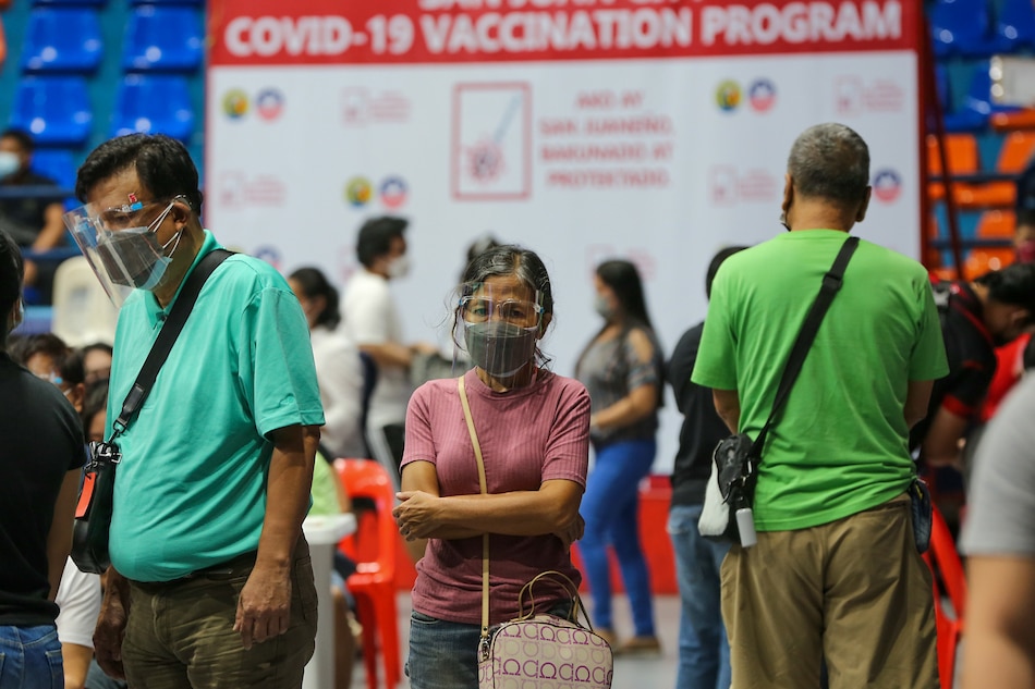 Residents receive their Covid-19 booster shots at the FilOil Arena as the City of San Juan resumes its vaccination for its residents on January 03, 2021. Jonathan Cellona, ABS-CBN News