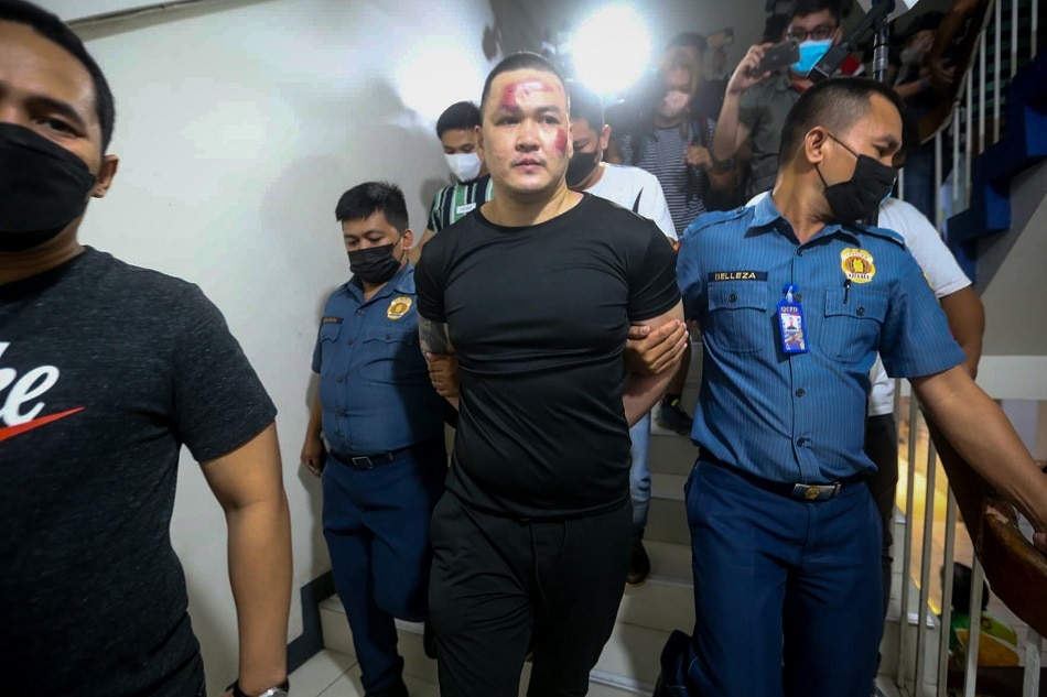 Chao-Tiao Yumol, the suspect in the shooting incident at the Ateneo De Manila campus that claimed three lives is taken into custody at the Quezon City Police District on July 24, 2022. ABS-CBN News