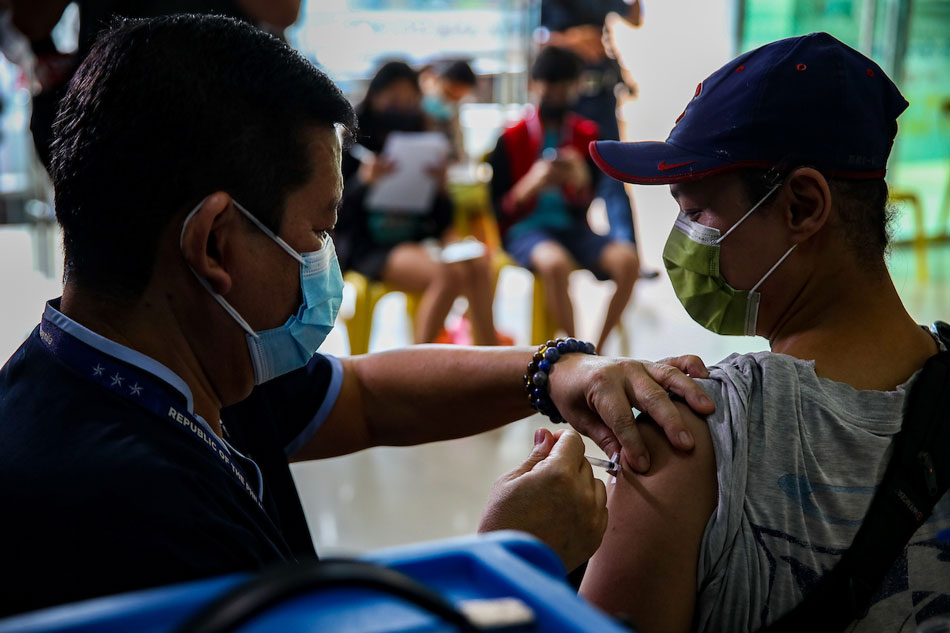 People eligible for the 2nd booster against COVID-19 receive their shots of the Pfizer vaccine at the Sta Ana Hospital in Manila on July 20, 2022. Jonathan Cellona, ABS-CBN News/File