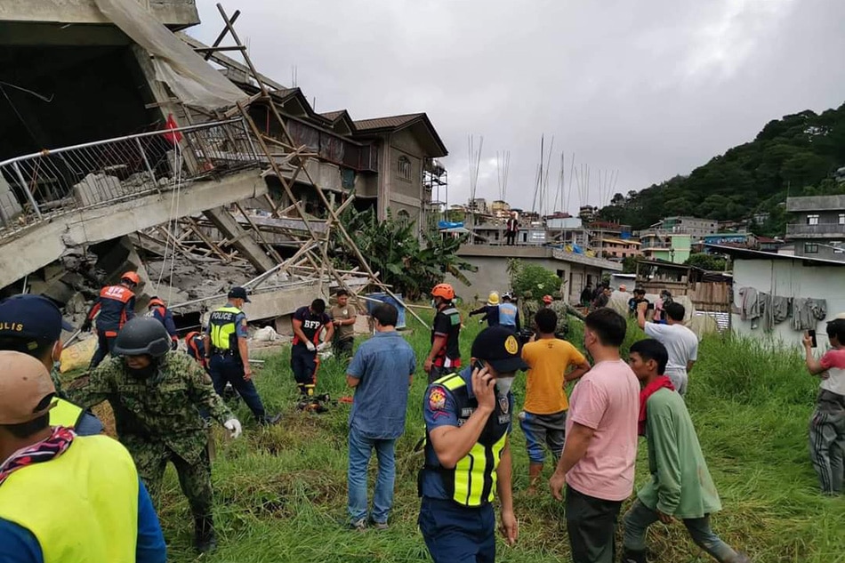 Authorities in La Trinidad, Benguet attempt to recover a construction worker reported killed in the magnitude 7 earthquake that hit Luzon on July 27, 2022. La Trinidad PNP handout