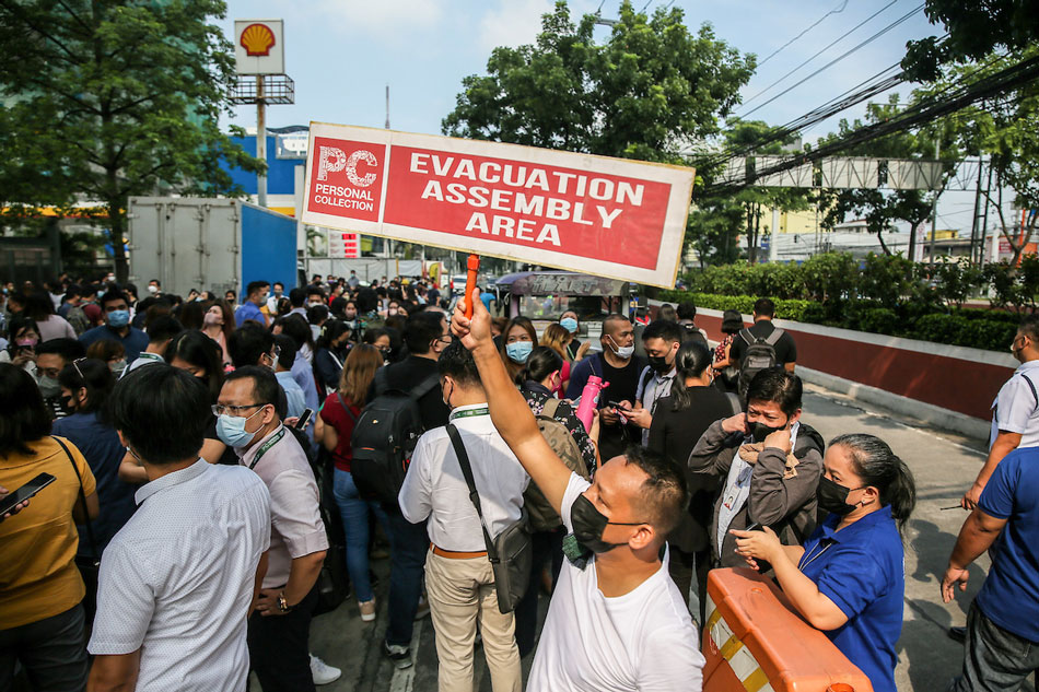 Employees evacuate along Quezon Avenue in Quezon City after a 7.0 magnitude earthquake on Wednesday. Jonathan Cellona, ABS-CBN News