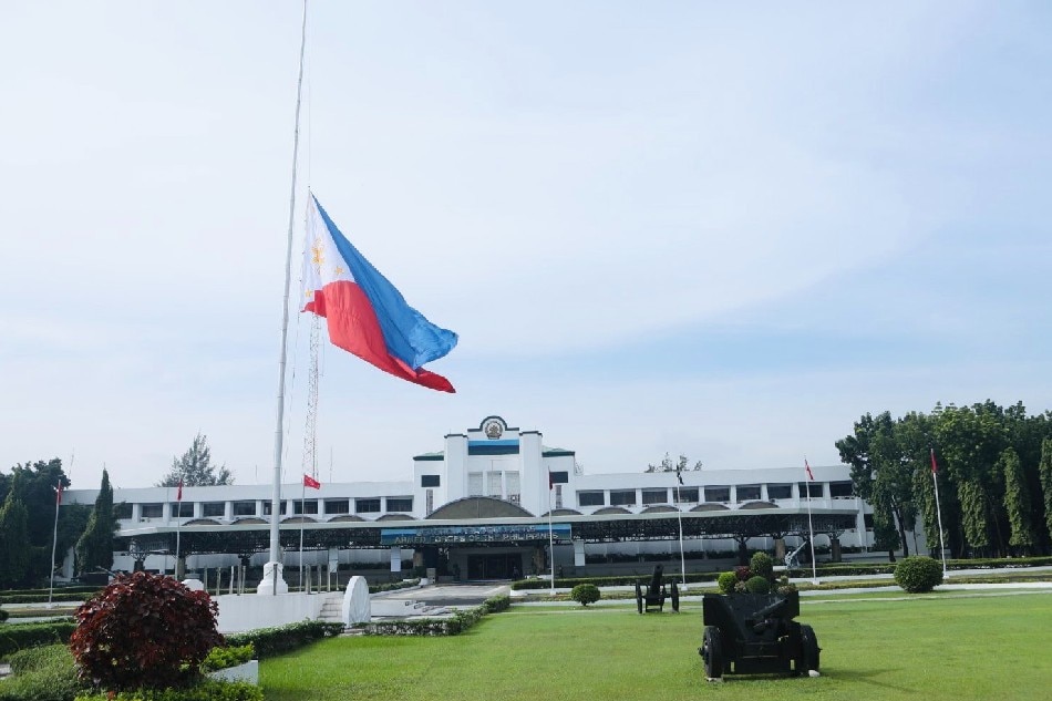 The Philippine flag flies at half-mast at AFP headquarters in Camp Aguinaldo, Quezon City to mourn death of former president Fidel Ramos. Bianca Dava, ABS-CBN News