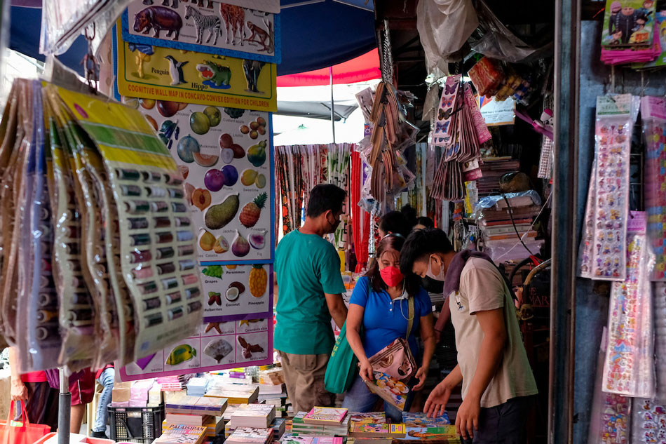 Customers purchase various learning materials from a school supplies store in Divisoria, Manila on July 14, 2022. George Calvelo, ABS-CBN News