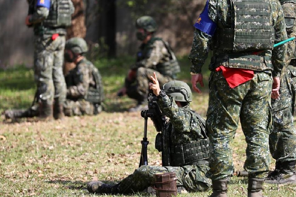 Taiwanese military personnel practice with a mortar during the visit of President Tsai Ing-wen at a military camp in New Taipei city, Taiwan, March 12, 2022. Taiwanese military and war experts are studying the current Russian invasion of Ukraine. Ritchie B. Tongo, EPA-EFE/File 