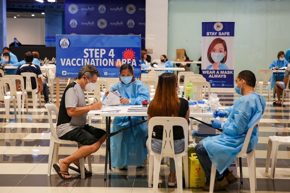 Eligible Makati residents line up to get their second booster shots against COVID-19 inside a mall in Makati City a day after the Department of Health (DOH) issued guidelines for its nationwide rollout on July 28, 2022. George Calvelo, ABS-CBN News