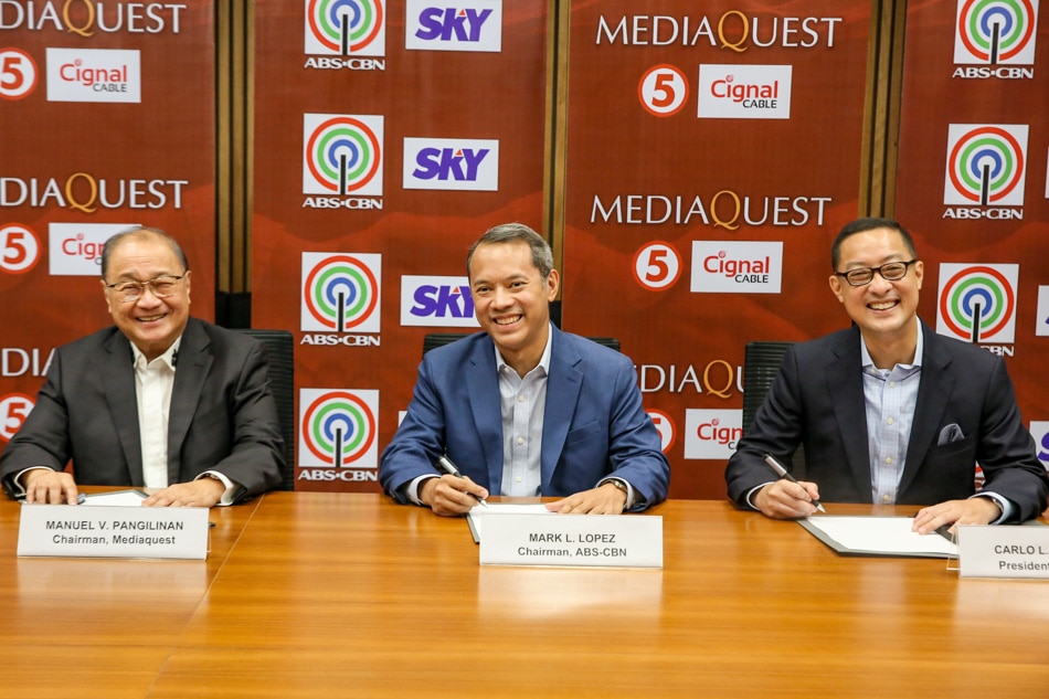 PLDT and MediaQuest Chairman Manuel Pangilinan, ABS-CBN Chairman Mark L. Lopez, and ABS-CBN President and CEO Carlo Katigbak sign a partnership deal for the two media companies. Jonathan Cellona, ABS-CBN News 