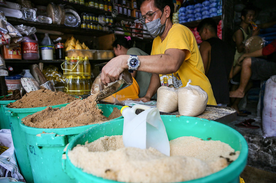  Vendors sell sugar by the kilo at the Bagong Silang public market in North Caloocan on Aug. 11, 2022. Jonathan Cellona, ABS-CBN News