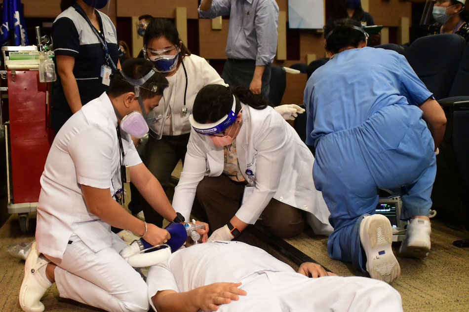 The Medical City in Pasig City simulates the flow of COVID-19 vaccination and possible unique scenarios in a drill on February 18, 2021, as the hospital awaits the arrival of the vaccines for its health care workers and allied partners. Mark Demayo, ABS-CBN News
