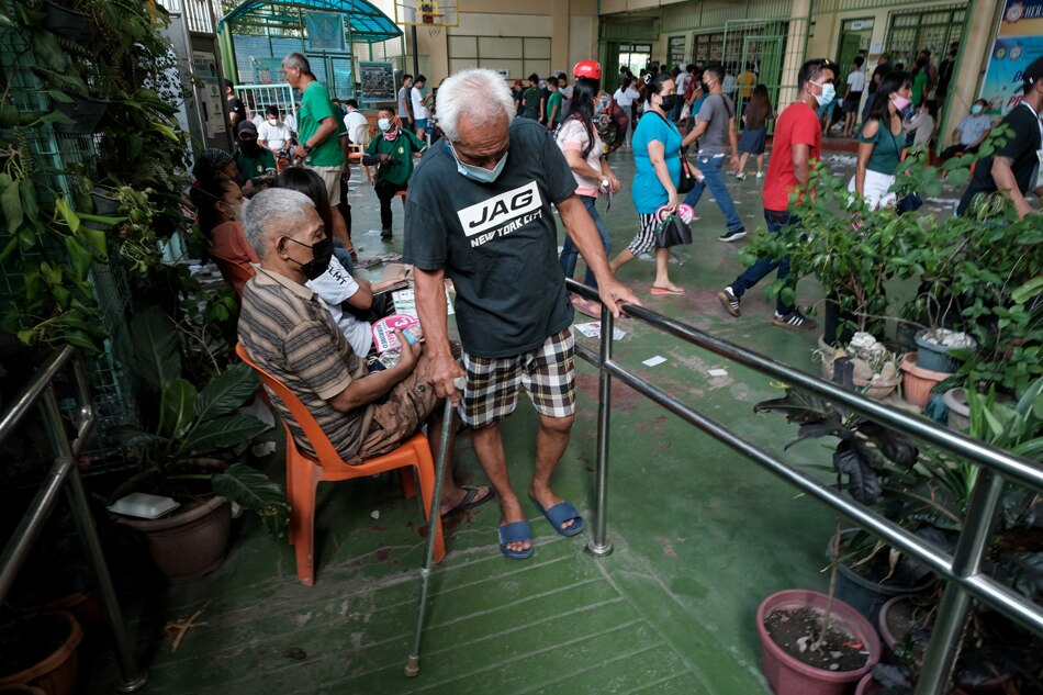 A senior citizen makes his way to a voting precinct in Baseco, Tondo, Manila on May 9, 2022. Fernando G. Sepe Jr., ABS-CBN News/file