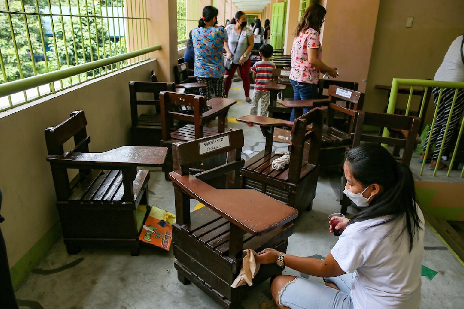 Parents and pupils help clean the San Antonio Elementary School in Quezon City on Aug. 3, 2022. Jonathan Cellona, ABS-CBN News 