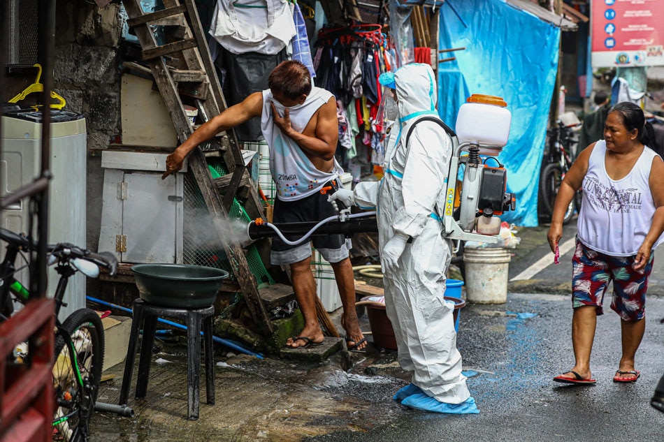 A personnel from the San Juan Health Department conducts a misting operation against dengue at Barangay Corazon de Jesus in San Juan City on Aug. 15, 2022. Jire Carreon, ABS-CBN News