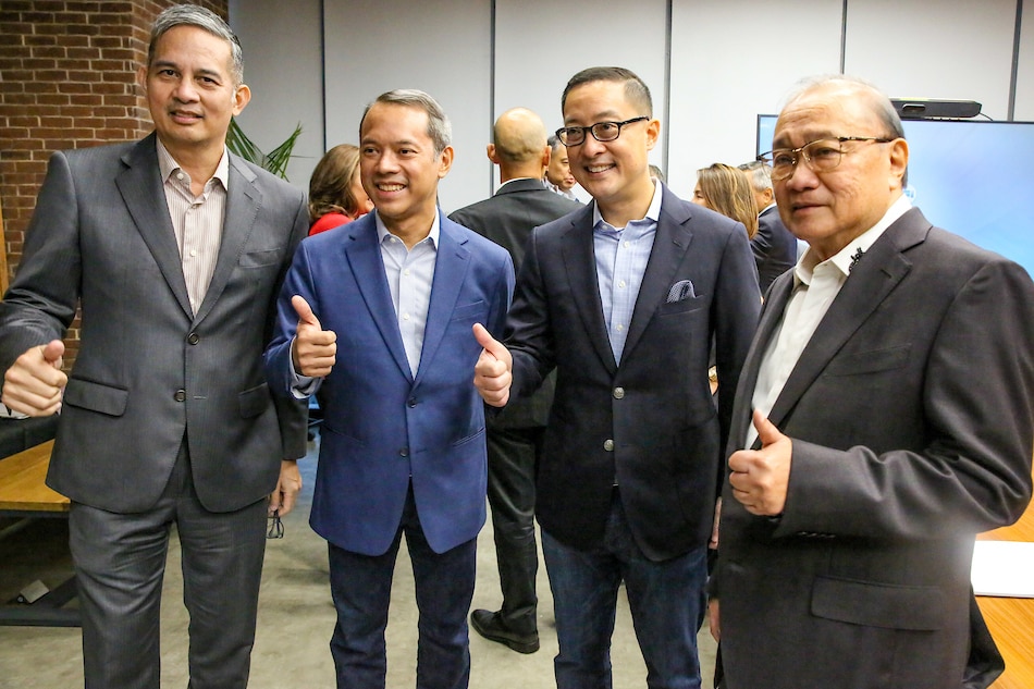 PLDT President Alfredo S. Panlileo, ABS-CBN Cairman Mark L. Lopez, ABS-CBN President Carlo L. Katigbak and Mediaquest Chairman Manuel V. Pangilinan give the thumbs up sign after the signing ceremony on August 10, 2022. Jonathan Cellona, ABS-CBN News