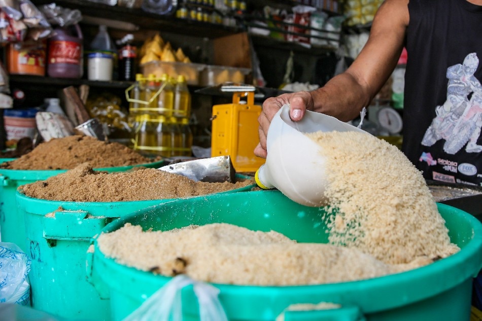  Vendors sell sugar by the kilo at the Bagong Silang public market in North Caloocan on August 11, 2022. Jonathan Cellona, ABS-CBN News