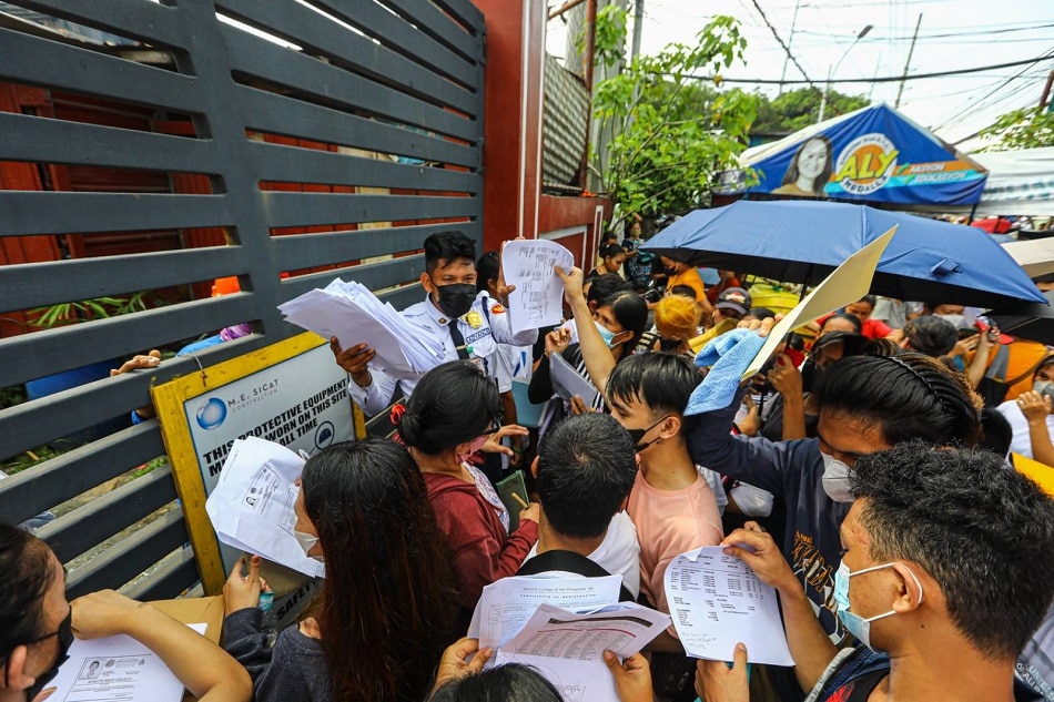 Thousands of people rush to the Department of Social Welfare and Development headquarters in Quezon City on August 20, 2022 to avail of the educational assistance being offered ahead of the first day of classes. Only those registered online have been permitted to claim their assistance forcing some to register and get their online DSWD QR registration forms outside the DSWD office. Jire Carreon, ABS-CBN News