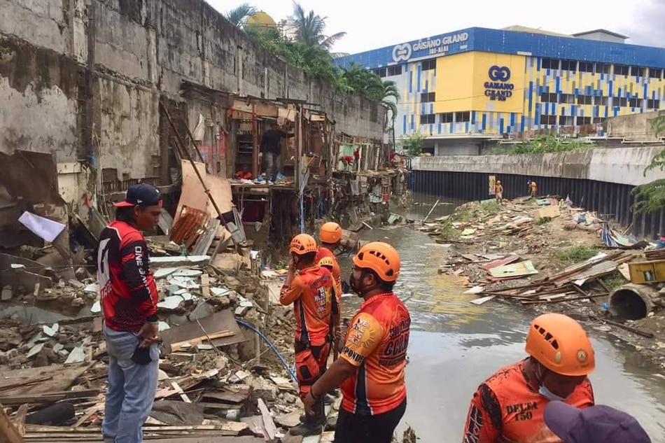 Members of the Cebu city Disaster Risk Reduction and Management Office remove illegal structures by the Kinalumsan River. Photo courtesy of Councilor Jerry Guardo 