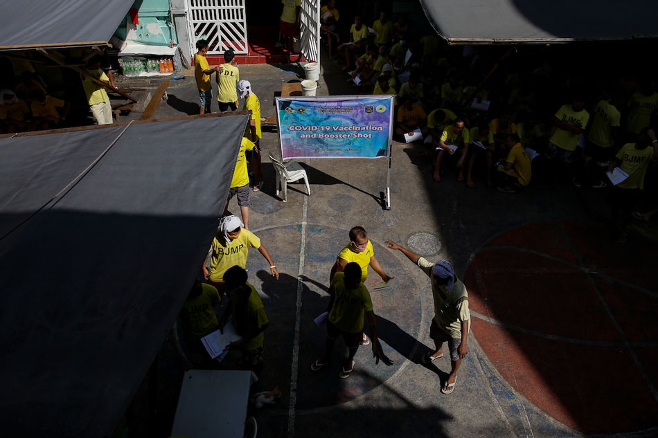 Persons deprived of liberty (PDL) get inoculated with AstraZeneca’s COVID-19 vaccine inside the Quezon City Jail on March 12, 2022. George Calvelo, ABS-CBN News
