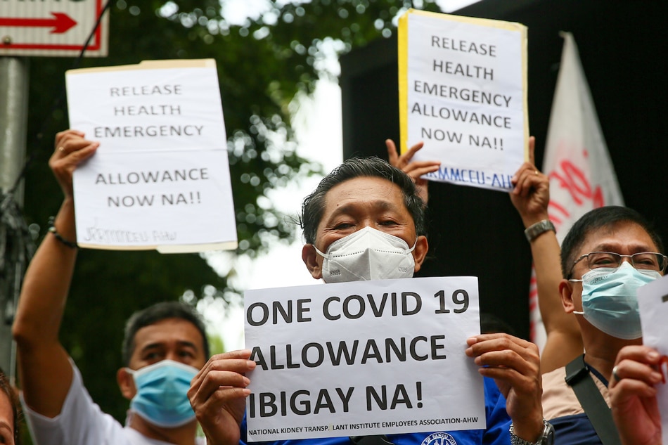 Health workers hold a picket outside the headquarters of the Department of Health in Manila on Sept. 6, 2022 to protest over the unreleased COVID-19 benefits. Jonathan Cellona, ABS-CBN News