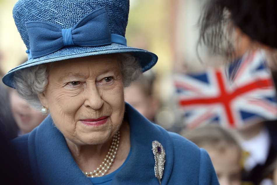 Queen Elizabeth II looks on as she leaves the Royal Holloway University in Egham, Surrey, Britain, March 14, 2014. Facundo Arrizabalaga, EPA/file