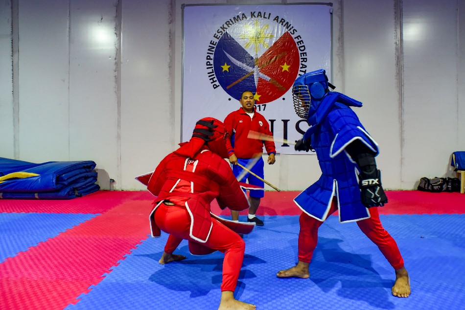 The full contact live stick event is demonstrated by the national arnis team during a training session at Rizal Memorial Stadium in Manila on August 20, 2019. George Calvelo, ABS-CBN News/file