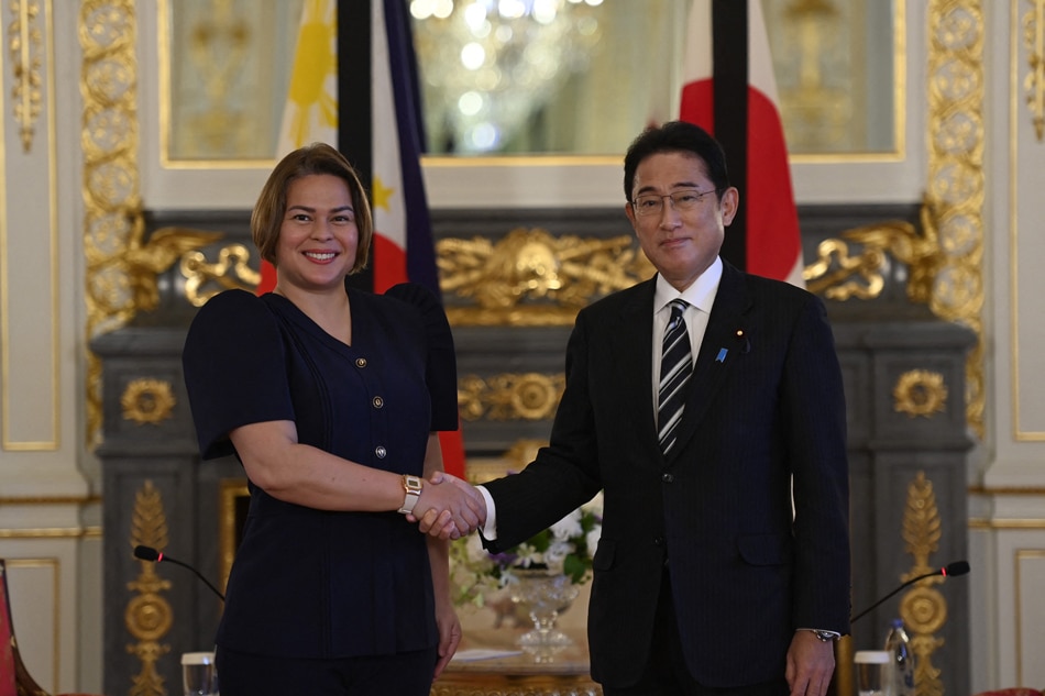  Philippine Vice President Sara Duterte (L) shakes hands with Japan's Prime Minister Fumio Kishida (R) prior to the Japan-Philippine bilateral Meeting at Akasaka Palace State Guest House in Tokyo on September 26, 2022, ahead of the state funeral for the former Japanese prime minister Shinzo Abe. David Mareuil / POOL / AFP
