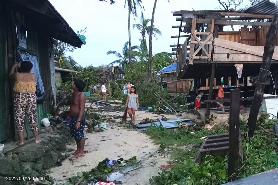 Residents assess damages caused by Super Typhoon Karding on September 26, 2022, a day after it made landfall in Burdeos, Polillo Islands in Quezon Province. Courtesy of Kevin Morillo/File