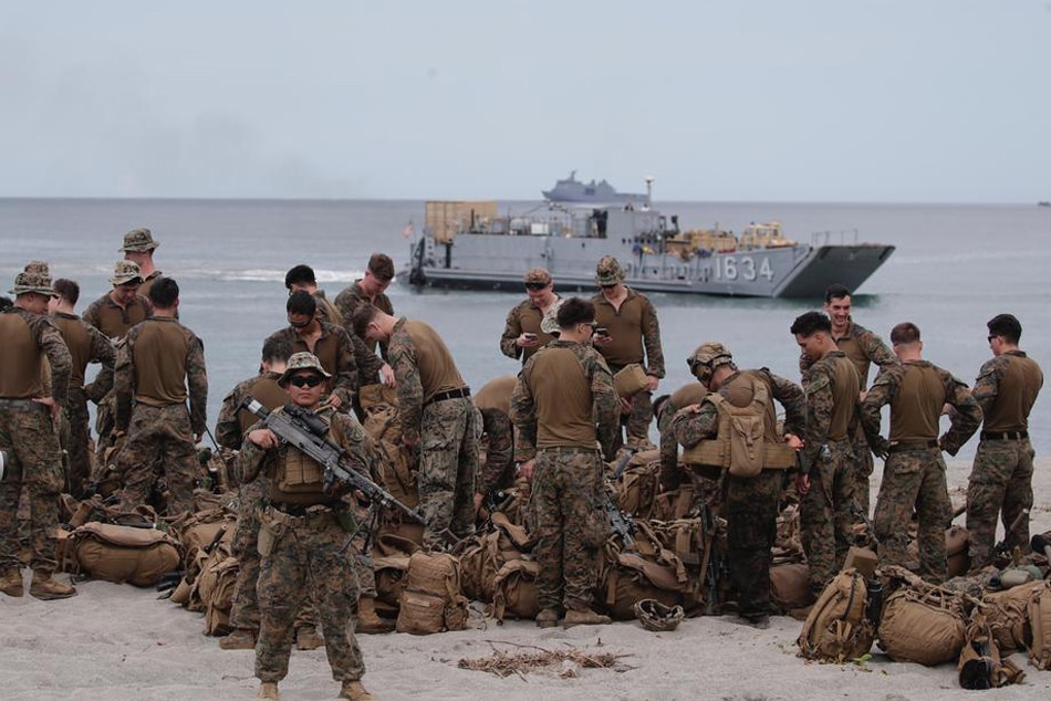  United States marines gather on a beach during a landing drill in San Antonio, Zambales province, on Oct. 7, 2022. Marines from the US, South Korea, Japan, and Philippines held joint combat drills in different islands to improve interoperability in times of conflict. Francis R. Malasin, EPA-EFE 