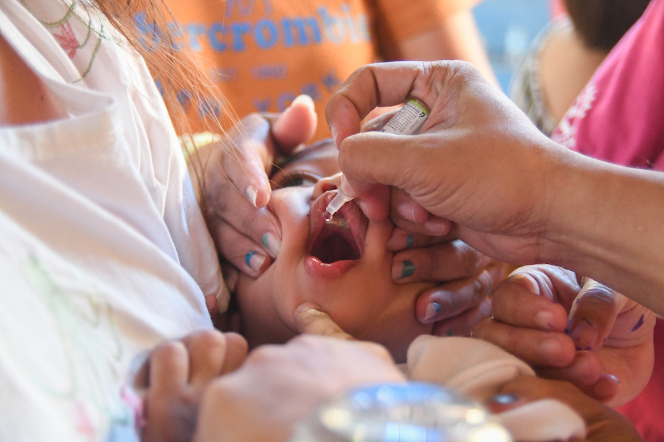 A child receives polio vaccine in Quezon City on Oct. 14, 2019. The Department of Health announced the reemergence of polio in the country after 19 years of being declared free from the disease. Mark Demayo, ABS-CBN News/File