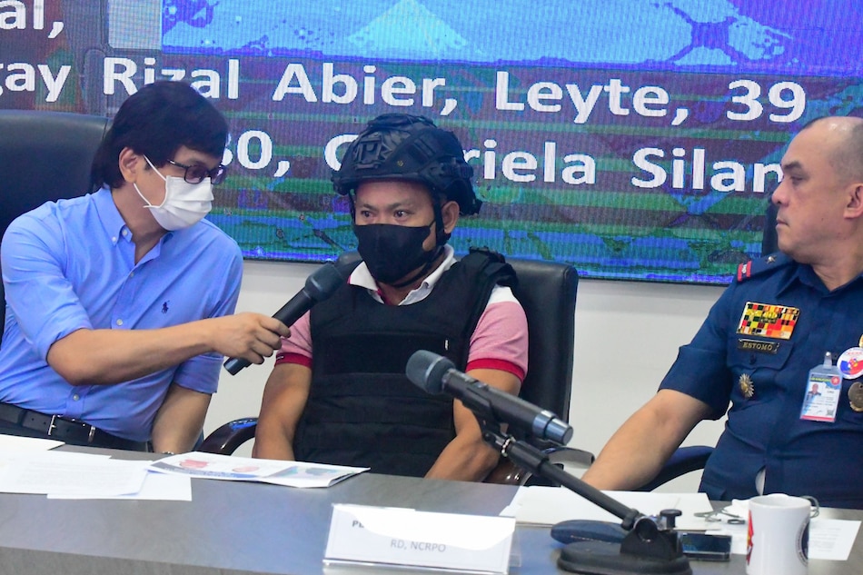 Interior Secretary Benhur Abalos presents Joel Salve Escorial, the suspected gunman in the killing of Percy Lapid, during a press conference at Camp Crame in Quezon City on Oct. 18, 2022. Mark Demayo, ABS-CBN News