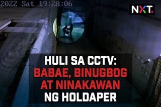 Huli sa CCTV: Babae, binugbog at ninakawan ng holdaper