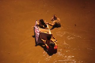 Wading to safety in Las Pinas