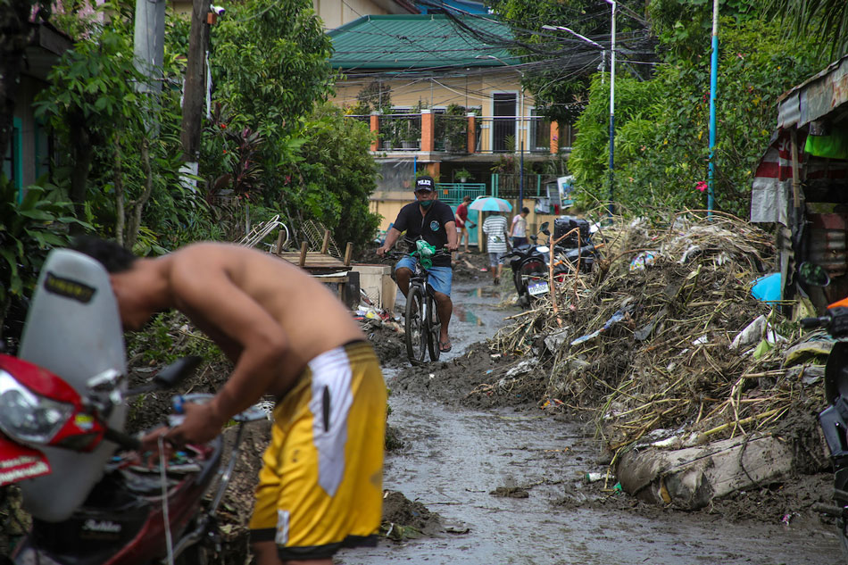 Residents clean up and look for salvageable items days after the onslaught of tropical storm Paeng in Antonio Dos, Noveleta, Cavite on Nov. 1, 2022. Jonathan Cellona, ABS-CBN News