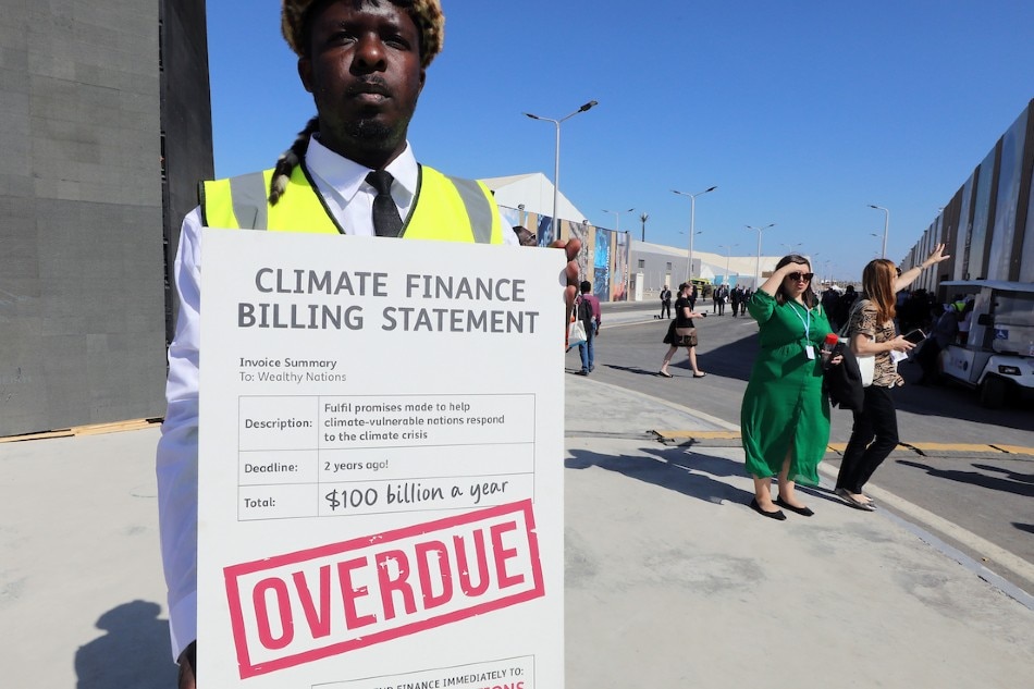  A protester holds a banner during the 2022 United Nations Climate Change Conference (COP27) in Sharm El-Sheikh, Egypt, Nov. 9, 2022. COP27 runs from Nov. 6 to 18, and is expected to host one of the largest number of participants in the annual global climate conference as over 40,000 estimated attendees, including heads of states and governments, civil society, media and other relevant stakeholders will attend. Khaled Elfiqi, EPA-EFE 