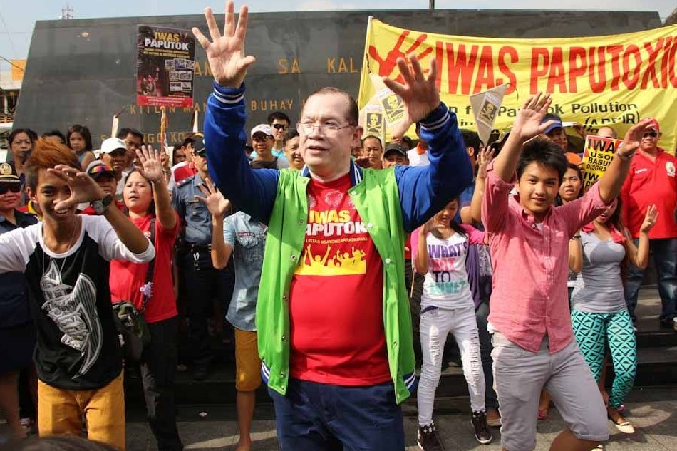 DOH Assistant Secretary Dr. Eric Tayag dances in front of Sto. Nino de Tondo church, Manila as he leads a campaign against the use of fire crackers during New Year's festivities, Dec. 27, 2013. Jhun Dantes Jr., ABS-CBN News/File