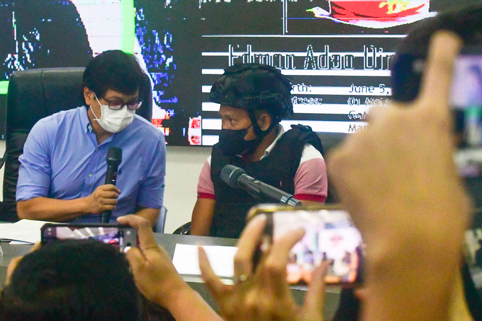 Interior Secretary Benhur Abalos presents Joel Escorial, the suspected gunman in the Percy Lapid case during a press conference at Camp Crame in Quezon City on Oct. 18, 2022. Mark Demayo, ABS-CBN News