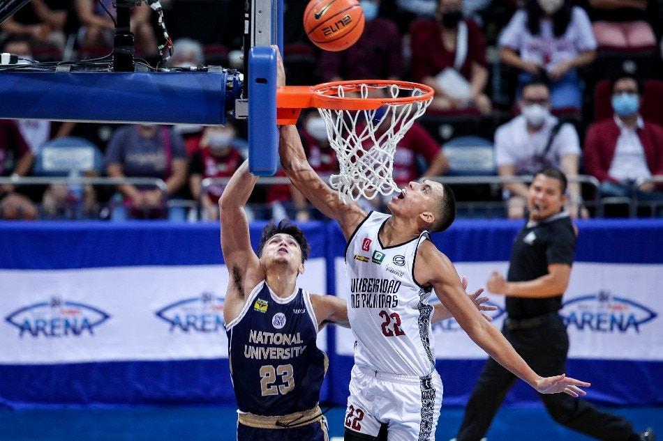 Zavier Lucero (22) of the UP Fighting Maroons drives to the hoop during their match against the NU Bulldogs at the University Athletic Association of the Philippines (UAAP) Season 85 held at the Mall of Asia Arena in Pasay City, October 12, 2022. George Calvelo, ABS-CBN News