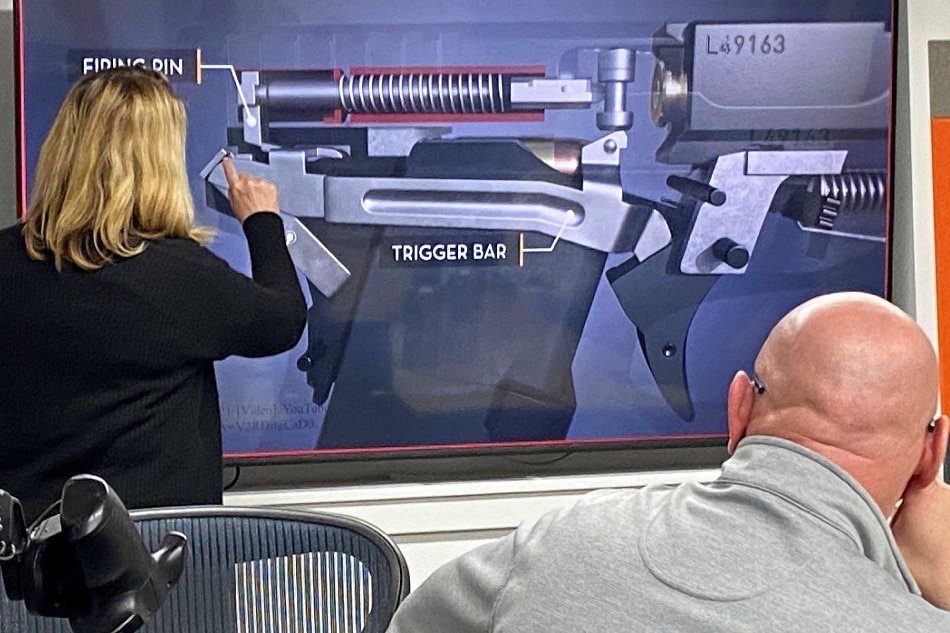 A LodeStar Works executives makes a presentation on the breakdown of their smart gun, which works only for the designated user, during a presentation for shareholders and potential investors in Boise, Idaho on January 7, 2022. Picture taken January 7, 2022. Brian Losness, Reuters