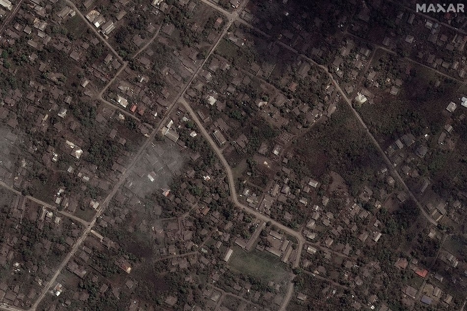 A satellite image shows ash covered homes and buildings after the main eruption of the Hunga Tonga-Hunga Ha