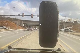 DASHCAM VIDEO: Runaway tire smashes cop car windshield