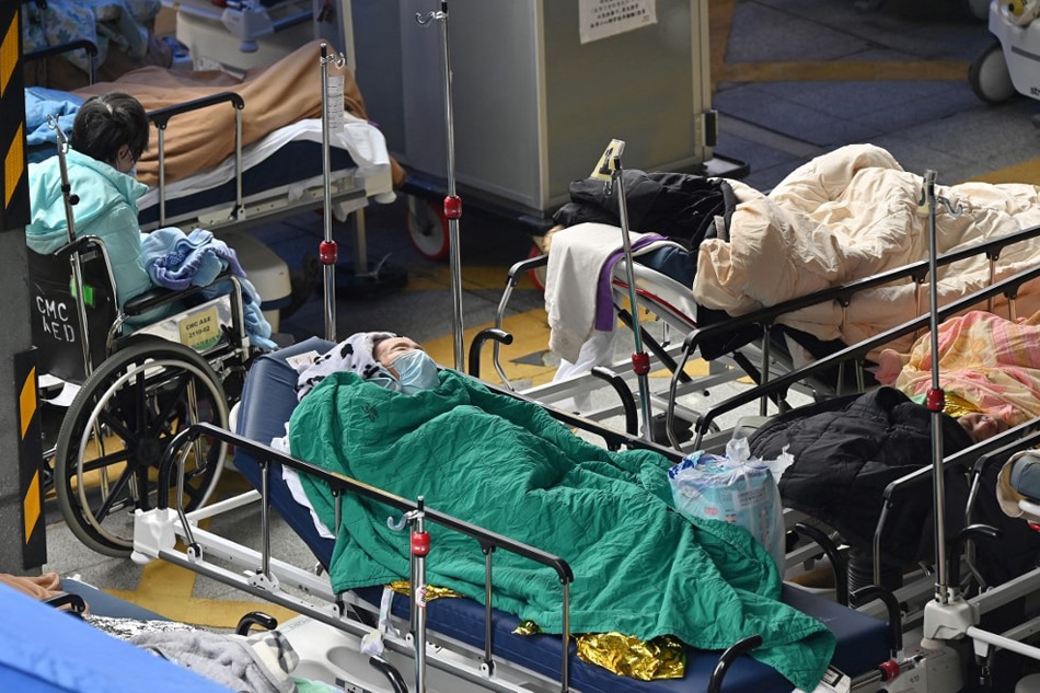 People lie in hospital beds outside the Caritas Medical Centre in Hong Kong on February 18, 2022, as the city faces its worst Covid-19 coronavirus wave to date. Peter Parks, AFP