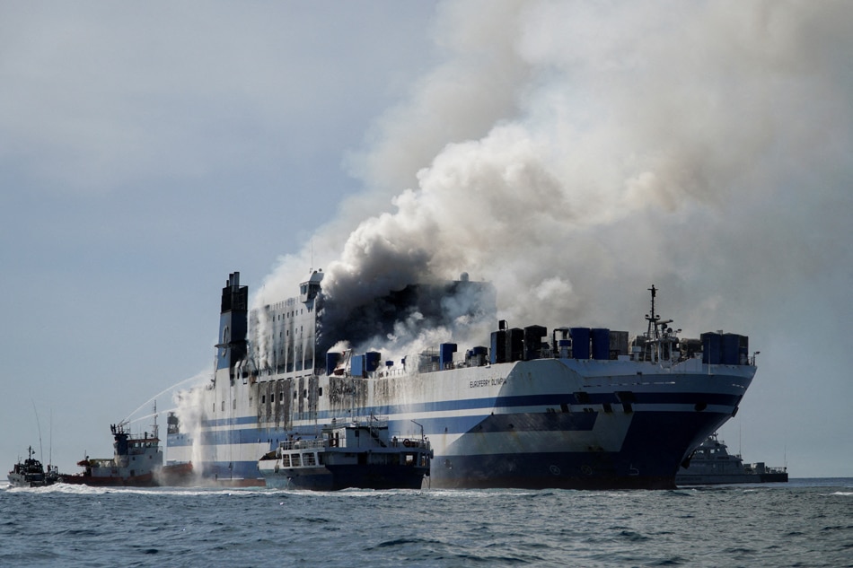 Smoke rises from the burning Italian-flagged Euroferry Olympia, after a fire broke out on the ferry, off the island of Corfu, Greece, February 18, 2022. Adonis Skordilis, Reuters