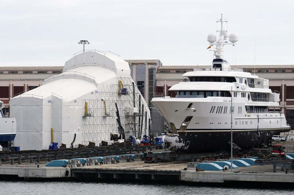 The Aurora yacht (R), property of Russian businessman Andrey Molchanov, is seen at the port of Barcelona, Spain, 02 March 2022. The yacht is one of several Russian vessels docked in Spanish ports and currently being probed by the General Directorate of the Merchant Marine (DGMM) to evaluate the impact of potential sanctions against Russia in the field of maritime traffic. EPA-EFE/Enric Fontcuberta