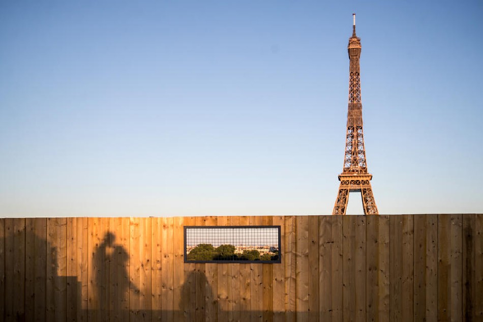Shadows of people walking at the Trocadero Human Rights Plaza with the Eiffel Tower in the background, in Paris, May 18, 2020. Mohammed Badra, EPA-EFE